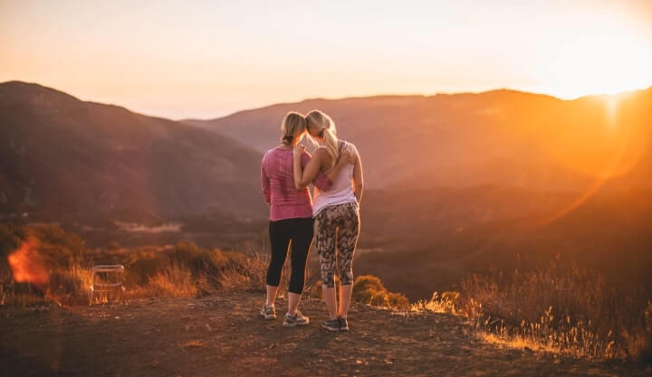 Two women watching the sunset