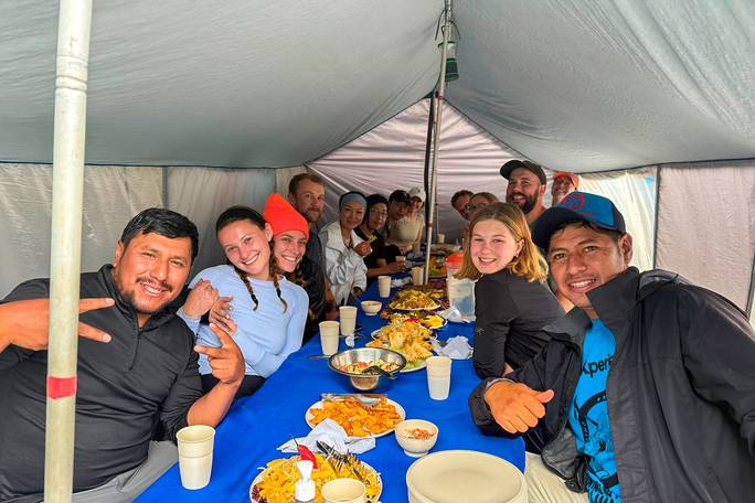 Meals are served in a warm dining tent, perfect for relaxing after a big day.