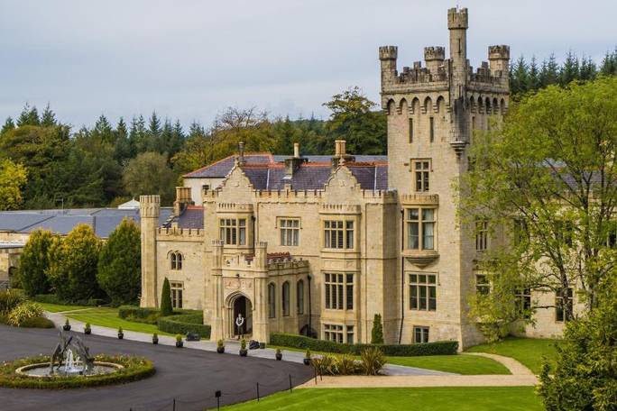 Set within 43 acres of forest at the foot of the mountains, this stunning castle boasts huge rooms and a luxurious spa within its beautiful gardens.
Cosy bathrobes and slippers are provided in each luxury room, along with a wood-panelled marble bathroom.