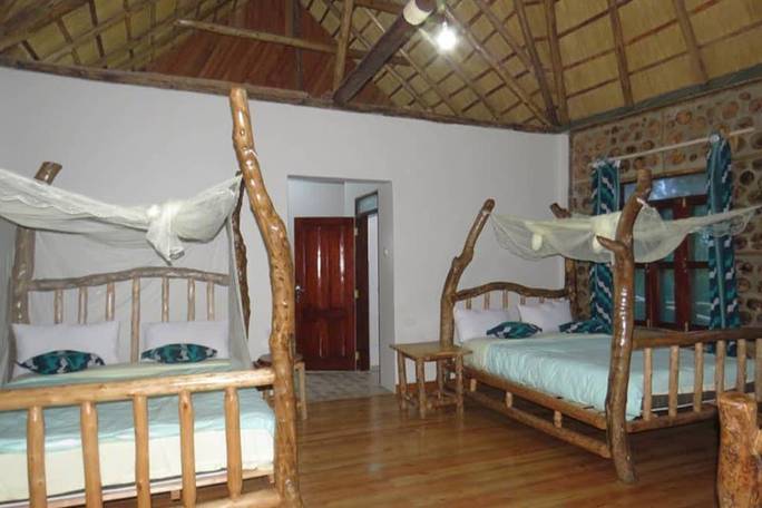 Spacious, comfortable twin cottages awaiting your arrival at Chimpanzee Capital Safari Lodge. Book your Kibale primate tour today! 🌲🏡