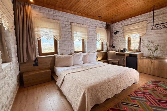Example boutique hotel room in Gjirokastra; or similar