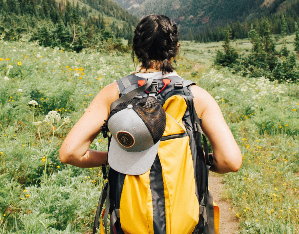 Girl hiking in green hills