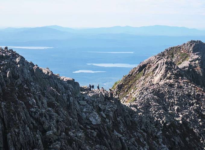 Hikers attempting to summit the grey Mount Katahdin in Baxter State Park