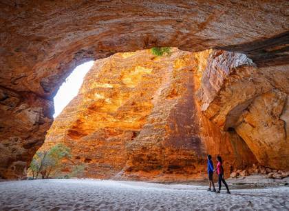 A man and a woman exploring the impressive caves and gorges of the outback Kimberlies
