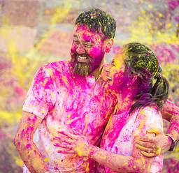 two people enjoying the holi festival of colours in india
