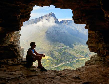 hiker looking at table mountain in africa