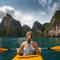 Woman kayaking in Halong Bay