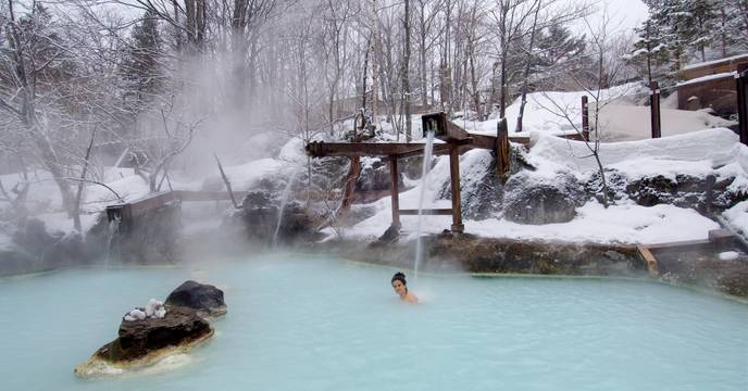 A person relaxing in an onsen