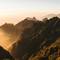 Mountains bathed in sunlight and mist