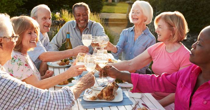 Group of seniors enjoying food and drink