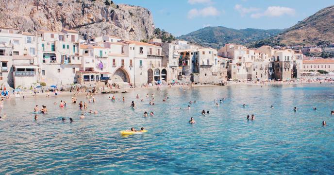 People swimming in azure colored waters