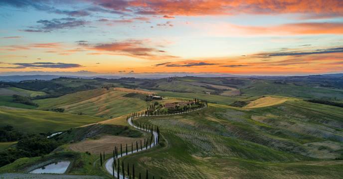 Winding road through rolling hills in Tuscany