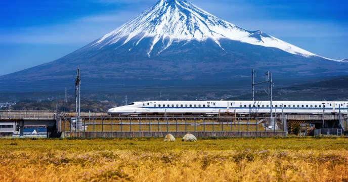 Bullet train and a snow-capped Mount Fuji