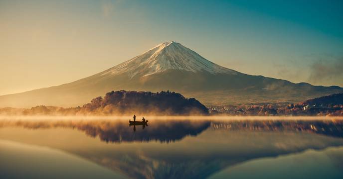 Mount Fuji's shadow reflected in a lake