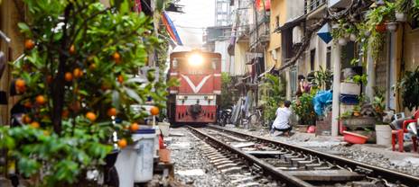 Train passing through Train Street in Hanoi