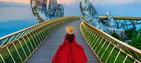 Woman walking along the Golden Bridge (Cầu Vàng) in Da Nang