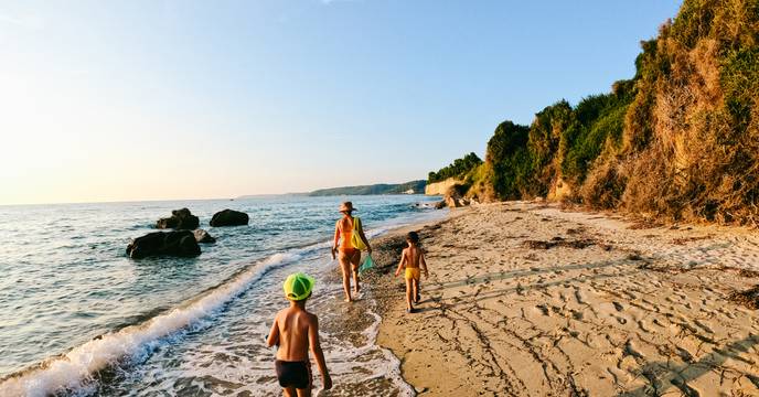 Family walking on a beach