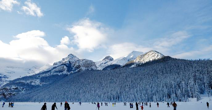 Ice Skating in front of Mountains