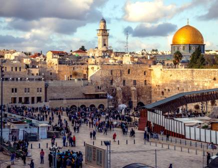 View of the Western Wall in Israel filled with tourists.