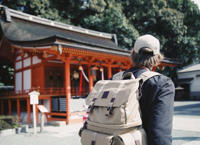 Man carrying a backpack in Fushimi Inari Taisha, Kyoto, Japan