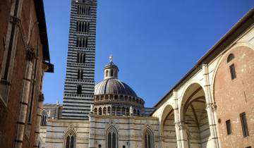 Detailed view of a cathedral with a striped bell tower.