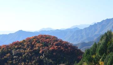 Mountain range with colorful autumn foliage.