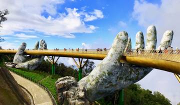 Golden Bridge with large stone hands in Vietnam.