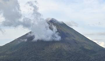 Arenal Volcano in the background with surrounding landscape.
