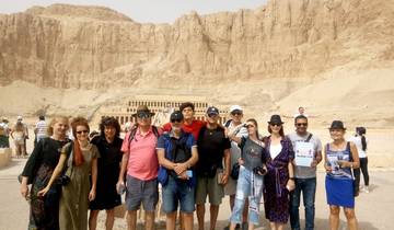 A group of people posing in front of the Mortuary Temple of Hatshepsut.