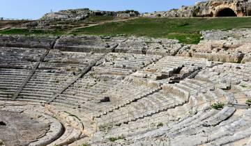 Ancient Greek theater with stone seating.