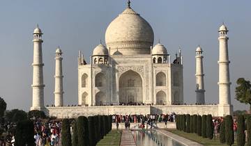 Crowds in front of the Taj Mahal, an ivory-white marble mausoleum.