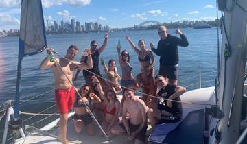 People enjoying a boat ride with the Sydney skyline in the background.