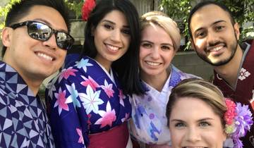 Group selfie of friends wearing kimonos.