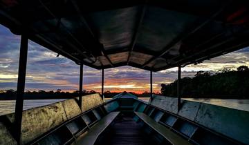 Sunset view from inside a boat on the river.