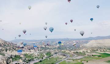 Hot air balloons soaring over Cappadocia's unique landscape.