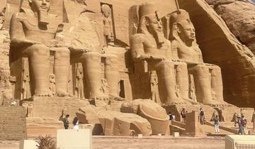 Ancient Egyptian statues carved into a massive stone temple.