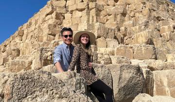 Two people posing near the Great Pyramids.