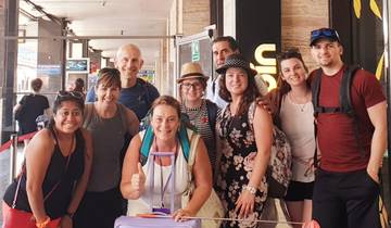 Group of people inside a station with bright smiles.
