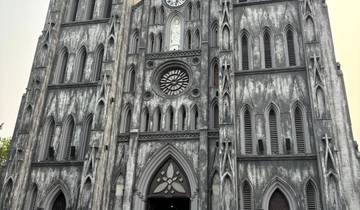 Gothic-style cathedral with people outside.