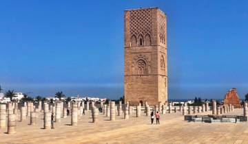 Hassan Tower in Rabat with surrounding columns and tourists.