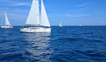 Sailboat cruising on the open sea.
