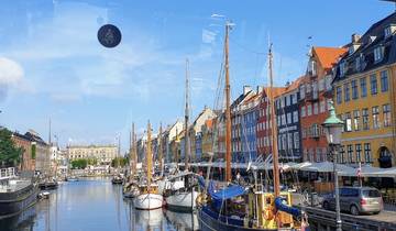 Colorful buildings and boats along a canal in Copenhagen