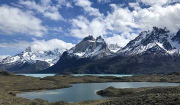 Mountain range with clear blue skies and reflections in the lake.