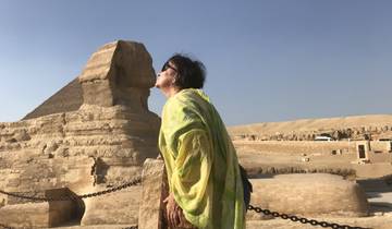 A person appearing to kiss the Great Sphinx in an optical illusion shot.