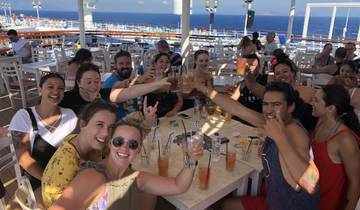Group of people on a cruise ship celebrating.