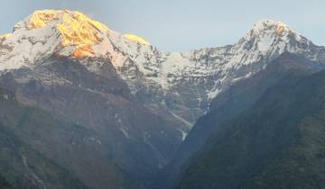Majestic mountain range with snow at sunrise.
