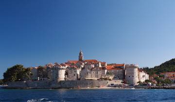 Scenic coastal view of a fortified historic town.