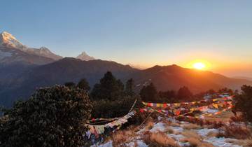 Mountains with prayer flags and sunrise.