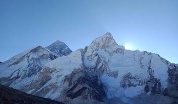 Snow-capped mountain peaks under a clear blue sky.