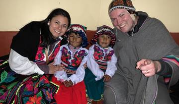 A group of people in traditional attire posing for a photo.